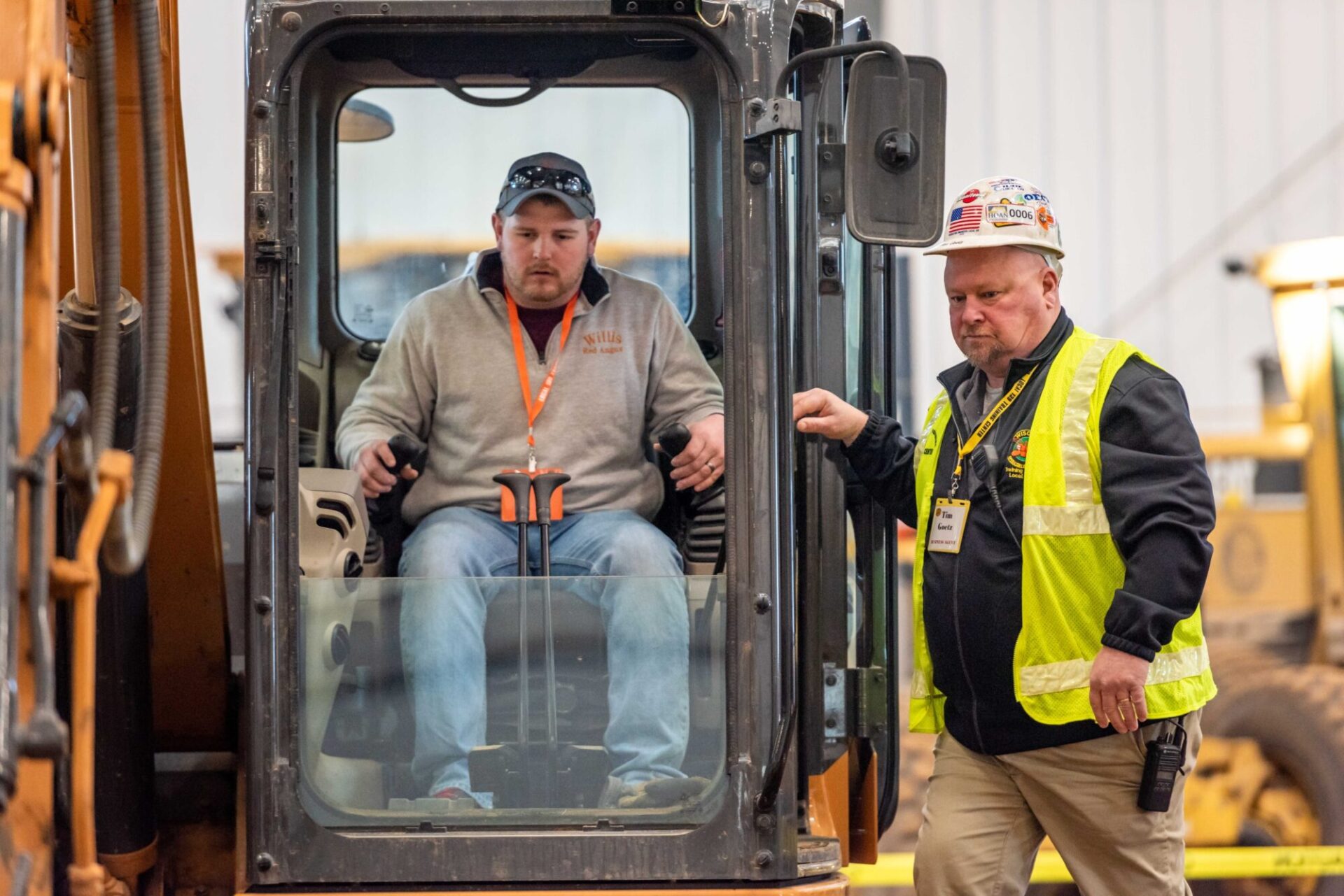 student learning to drive excavator