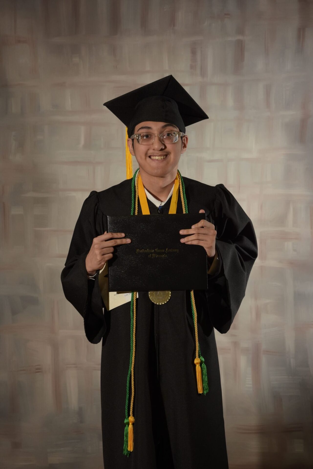 Graduate student showing the diploma