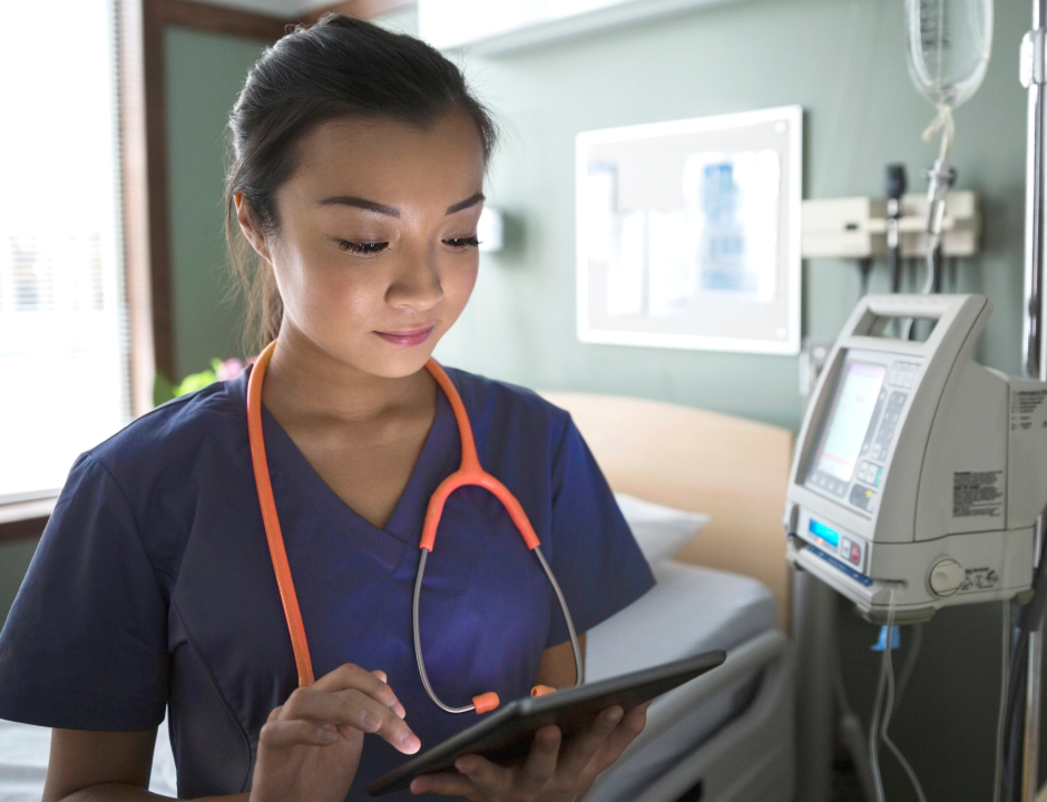Helth student working with her tablet at a hospital