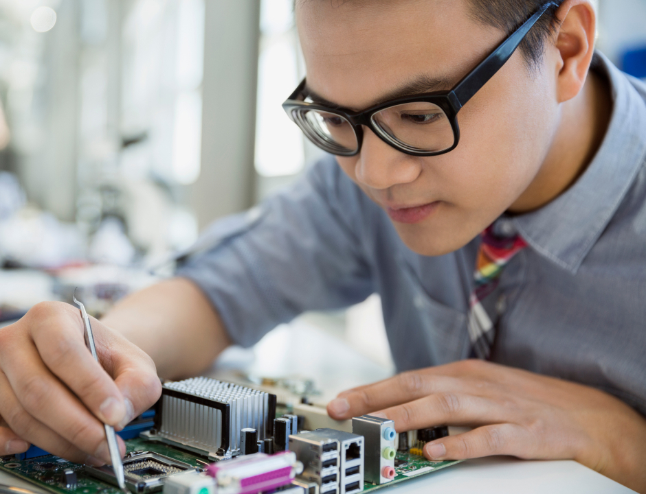IT student working with wires