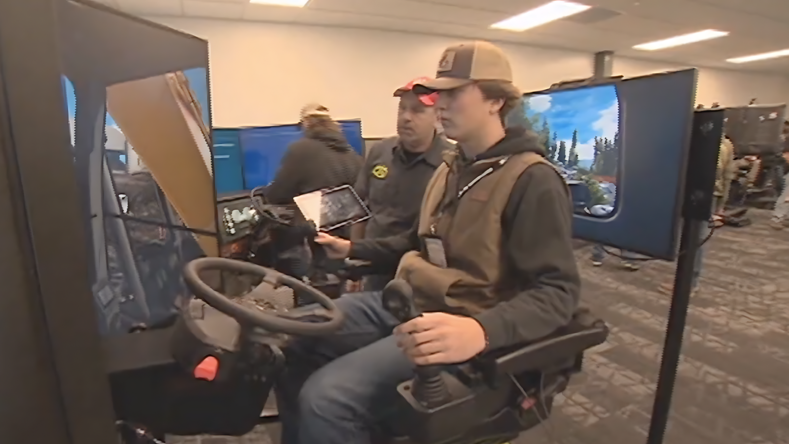 Two males wearing a hat